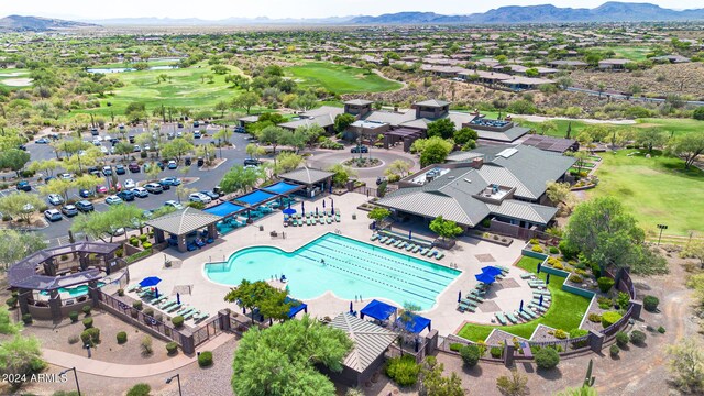 bird's eye view featuring view of golf course and a mountain view