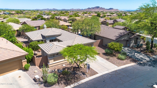 birds eye view of property with a residential view and a mountain view