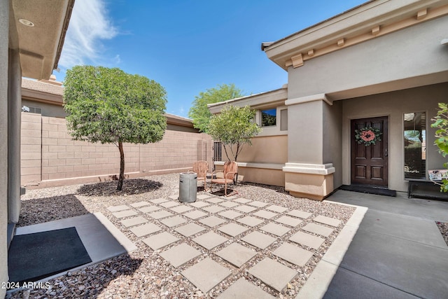 view of patio / terrace featuring fence
