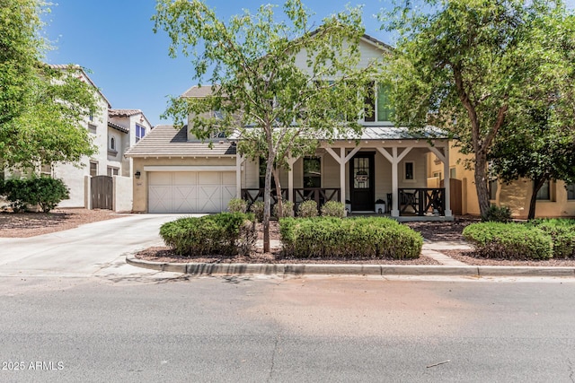 3109 N Black Rock Rd, Buckeye, AZ 85396 - view of front facade with a porch, driveway, a garage, and stucco siding