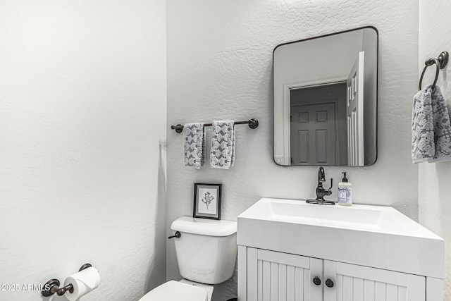 3109 N Black Rock Rd, Buckeye, AZ 85396 - half bath featuring toilet, a textured wall, and vanity