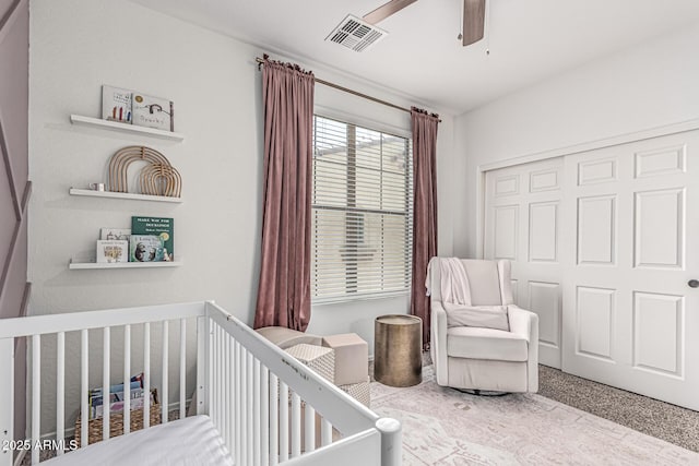 3109 N Black Rock Rd, Buckeye, AZ 85396 - carpeted bedroom featuring a nursery area, a closet, and ceiling fan