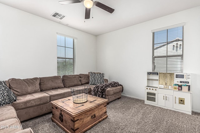 3109 N Black Rock Rd, Buckeye, AZ 85396 - living area with ceiling fan, carpet flooring, and baseboards