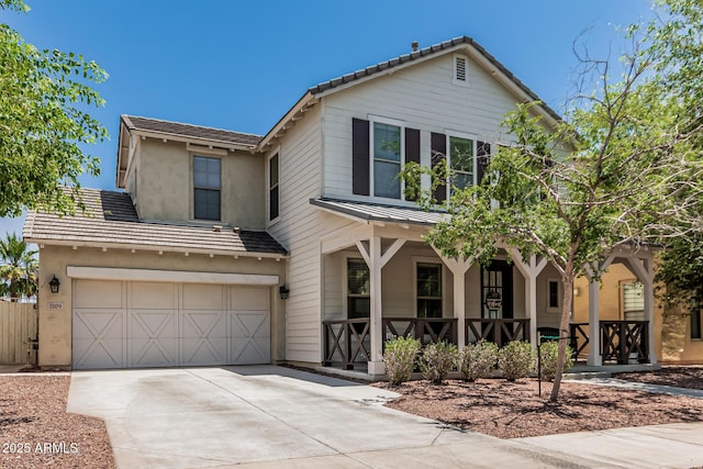3109 N Black Rock Rd, Buckeye, AZ 85396 - traditional-style house with covered porch, an attached garage, concrete driveway, stucco siding, and a tiled roof