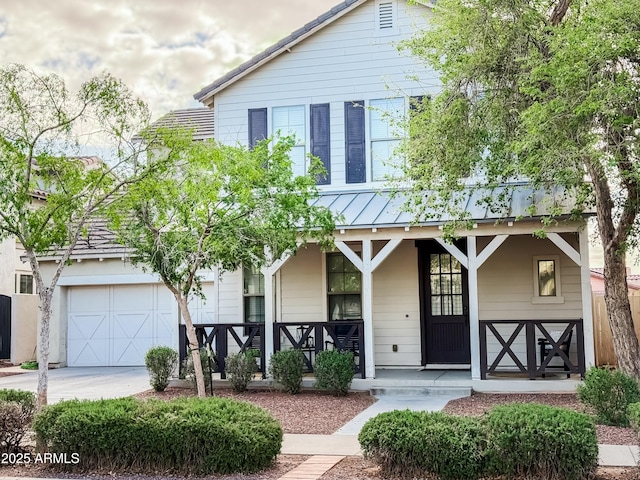 3109 N Black Rock Rd, Buckeye, AZ 85396 - view of front of home with covered porch, a standing seam roof, driveway, metal roof, and a garage