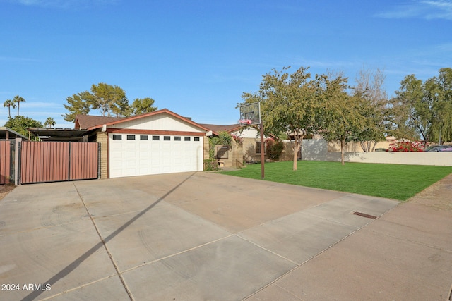 view of front facade with a front yard and a garage