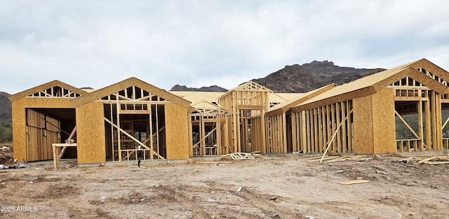 exterior space featuring an outbuilding, an exterior structure, and a mountain view