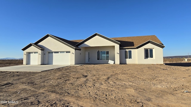 ranch-style home with a garage