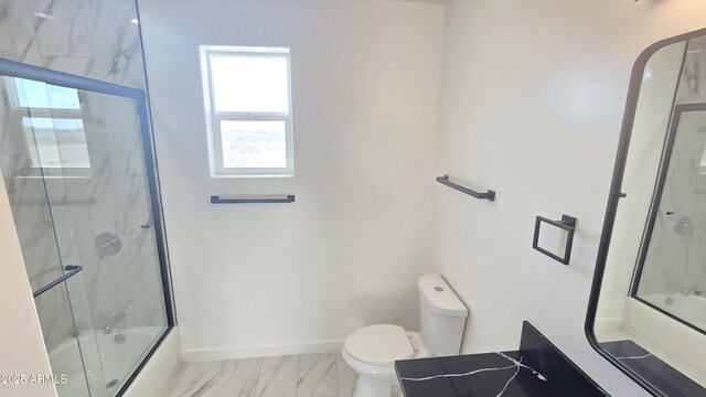 5536 N 375th Ave, Tonopah, AZ 85354 - bathroom with combined bath / shower with glass door, plenty of natural light, marble finish flooring, and toilet