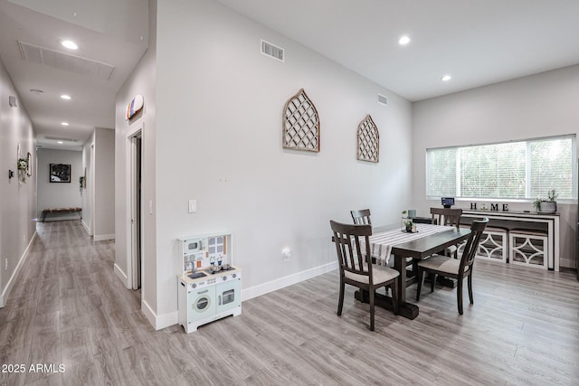 dining room featuring baseboards, recessed lighting, visible vents, and light wood-style floors