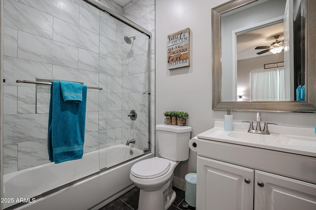 full bath featuring toilet, ceiling fan, combined bath / shower with glass door, and vanity