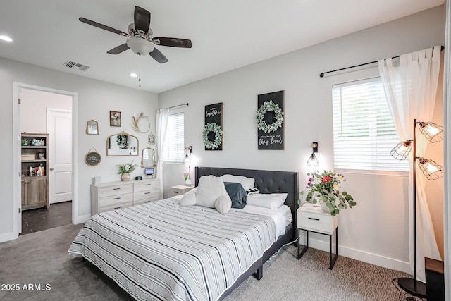 carpeted bedroom featuring baseboards, visible vents, and recessed lighting