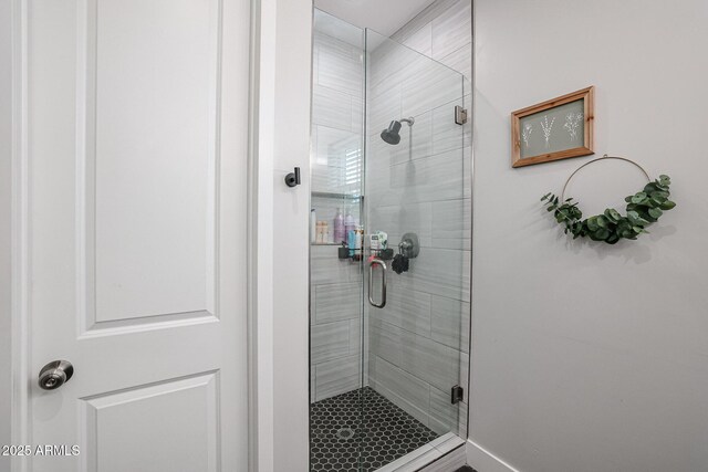 full bath with a shower stall