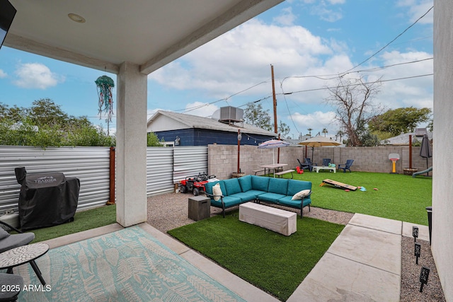 view of patio featuring outdoor lounge area and a fenced backyard