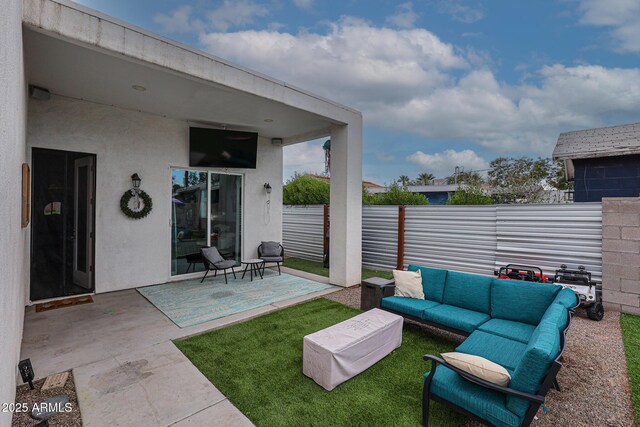 view of patio featuring fence and an outdoor hangout area