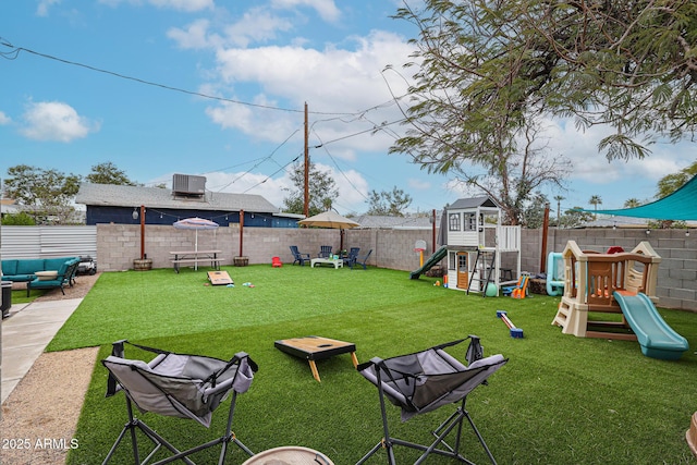 view of yard with a playground, a fenced backyard, and an outdoor living space