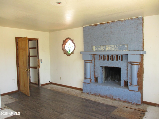 5716 E Desert Vista Trl, Cave Creek, AZ 85331 - unfurnished living room with wood finished floors, baseboards, and a fireplace