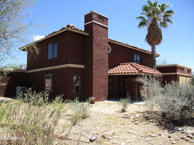 5716 E Desert Vista Trl, Cave Creek, AZ 85331 - back of property with a chimney, a tile roof, and stucco siding
