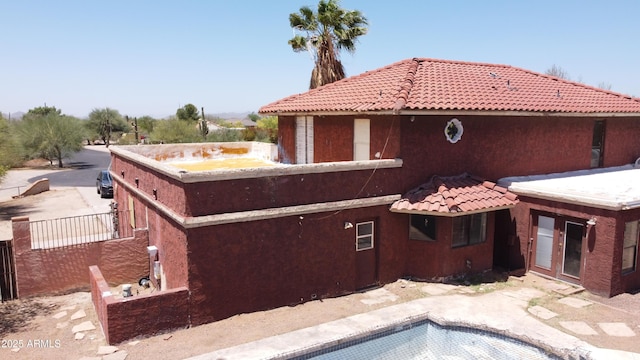 5716 E Desert Vista Trl, Cave Creek, AZ 85331 - view of property exterior with stucco siding, an outdoor pool, and a tiled roof