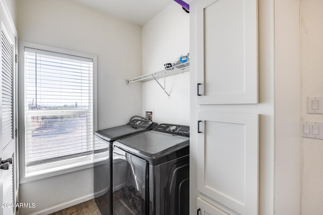 laundry room featuring washing machine and clothes dryer