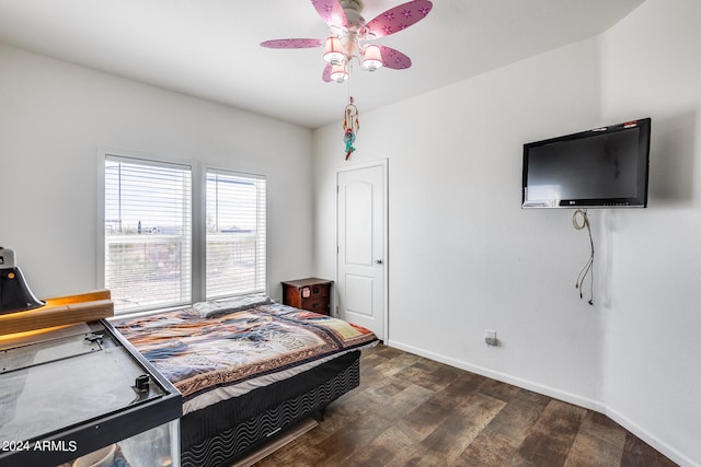 bedroom with ceiling fan and dark hardwood / wood-style flooring