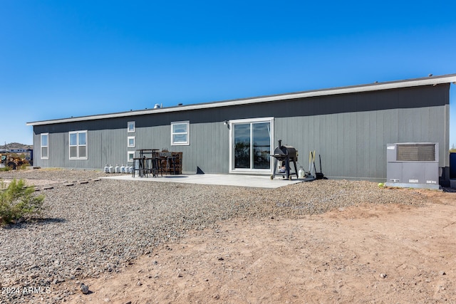 back of house with a patio