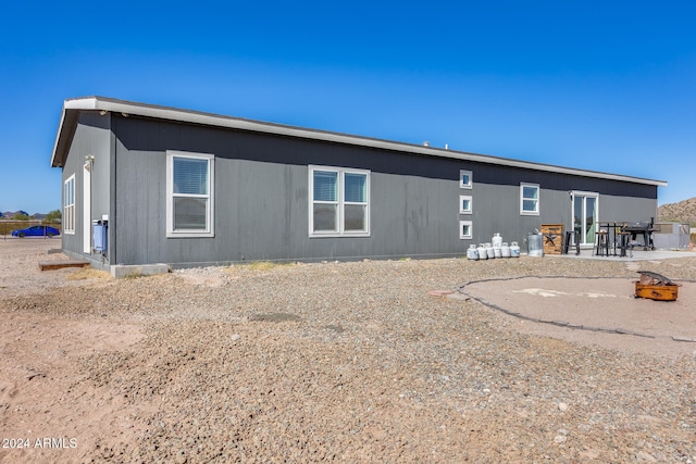 back of property featuring a patio area