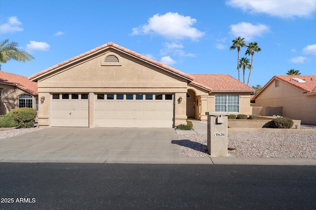 ranch-style home with a garage