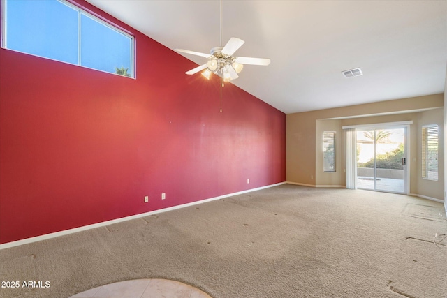 unfurnished living room with ceiling fan, carpet, and high vaulted ceiling