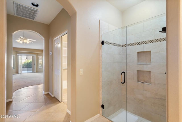 bathroom with an enclosed shower, tile patterned floors, and ceiling fan