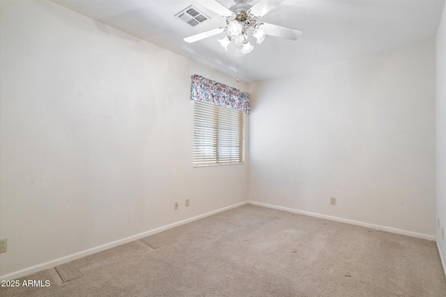 carpeted empty room with ceiling fan