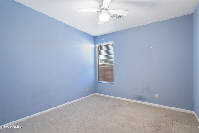 spare room with carpet and ceiling fan