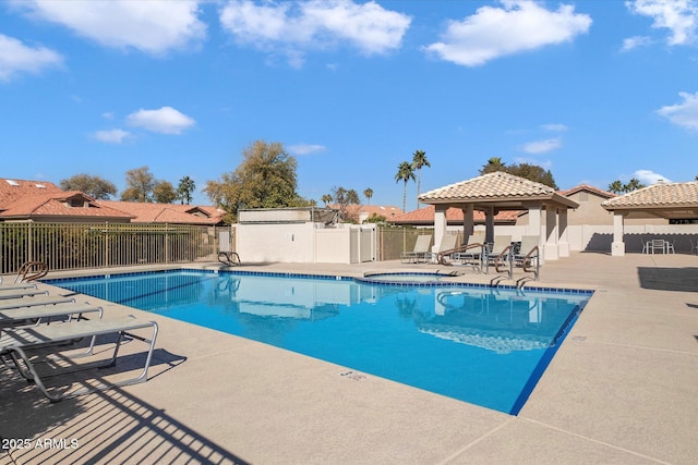 view of swimming pool featuring a gazebo and a patio area