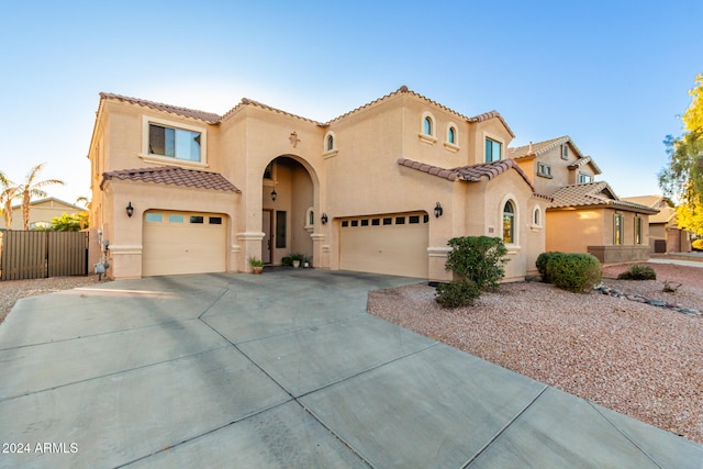 mediterranean / spanish-style house featuring a garage