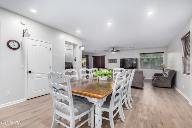 dining area featuring light hardwood / wood-style floors and ceiling fan