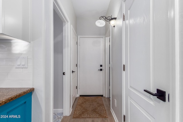 hall with light hardwood / wood-style floors