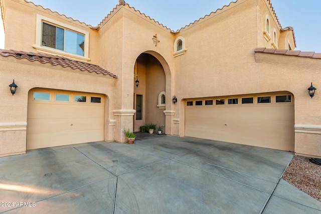 mediterranean / spanish-style house featuring a garage