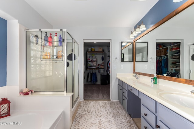 bathroom with separate shower and tub, tile patterned flooring, and vanity