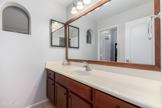 bathroom with tile patterned flooring and vanity