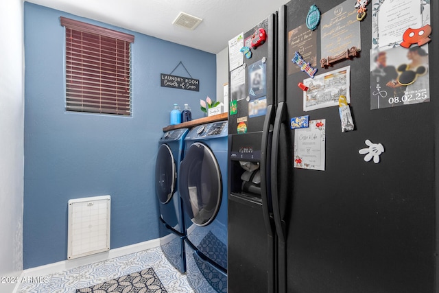 laundry room with washing machine and clothes dryer