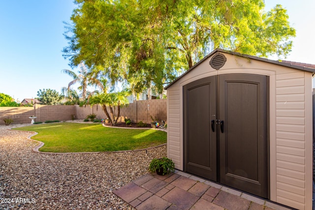 view of outdoor structure featuring a yard