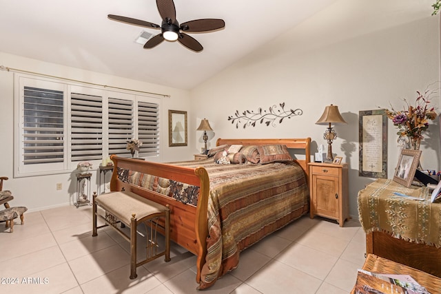 bedroom featuring ceiling fan, lofted ceiling, and light tile patterned floors