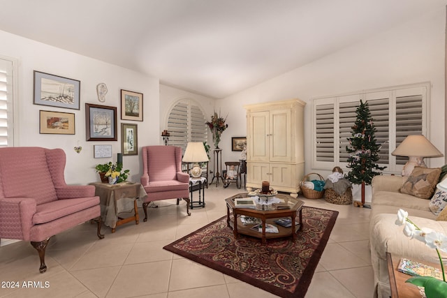 tiled living room featuring vaulted ceiling