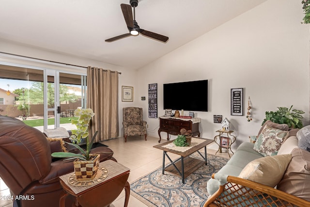 tiled living room with ceiling fan and lofted ceiling