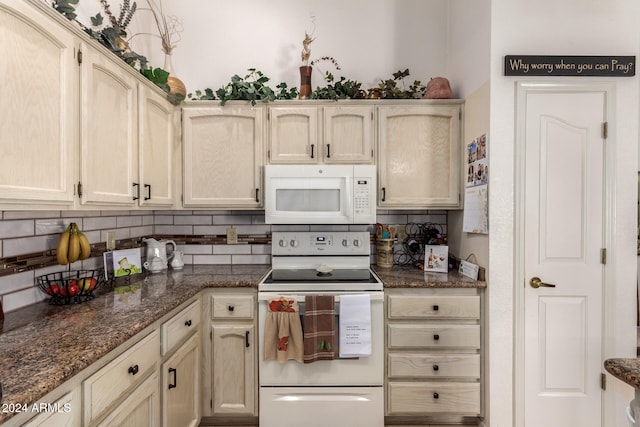 kitchen with white appliances, light brown cabinetry, dark stone counters, and tasteful backsplash