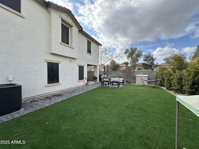 view of yard featuring cooling unit, an outdoor hangout area, and a patio