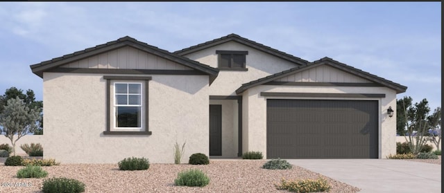 15731 W Brown St, Waddell, AZ 85355 - view of front of home featuring an attached garage, concrete driveway, and stucco siding