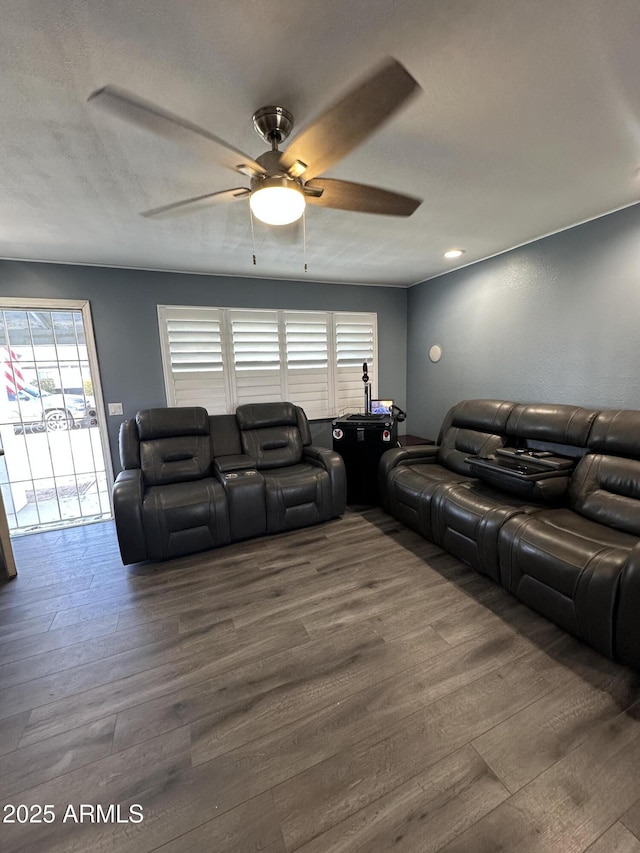 living room with ceiling fan and hardwood / wood-style floors