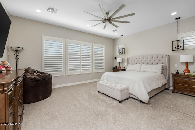 bedroom featuring ceiling fan and light carpet