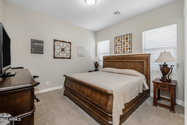 bedroom featuring light carpet